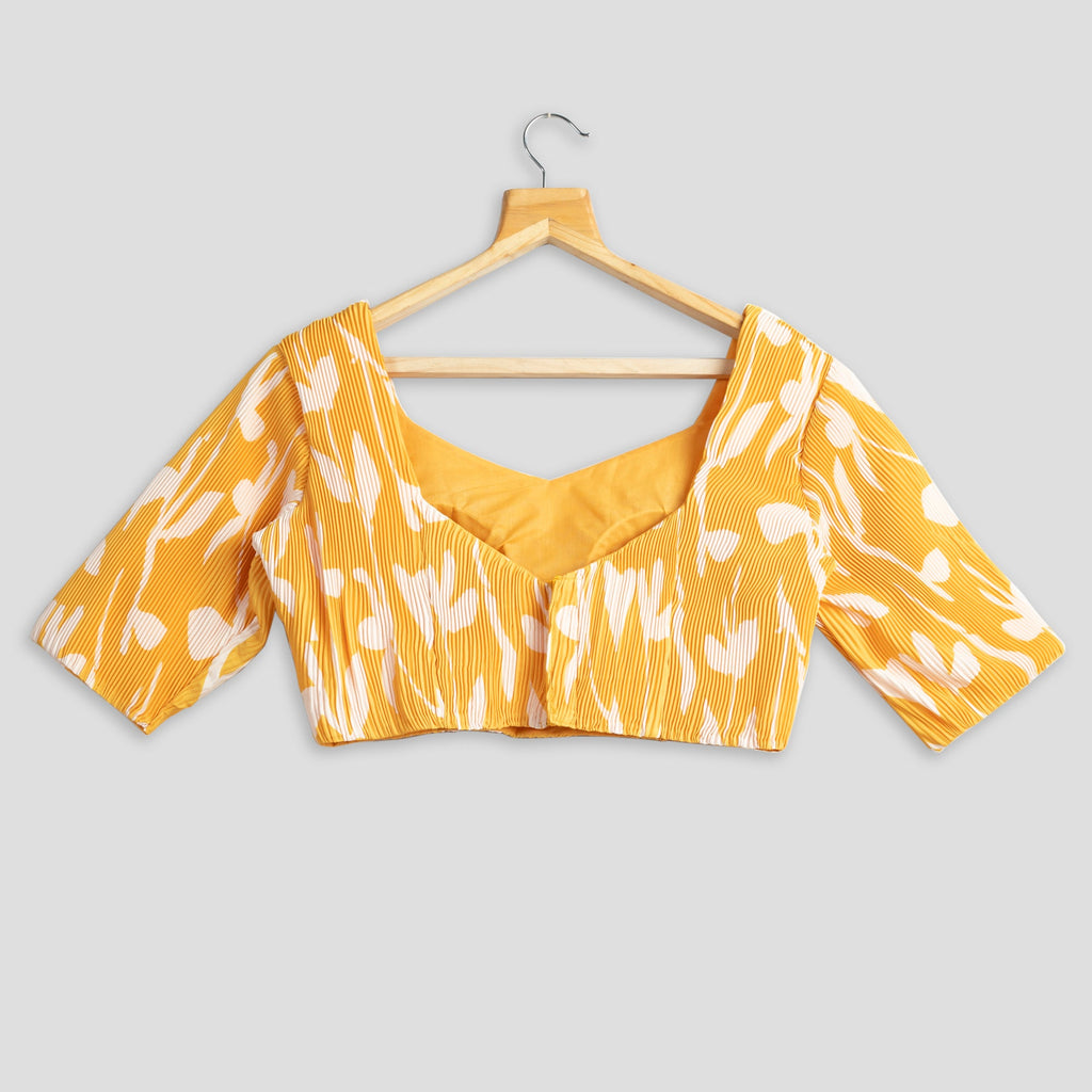 Blusa plisada floral amarilla