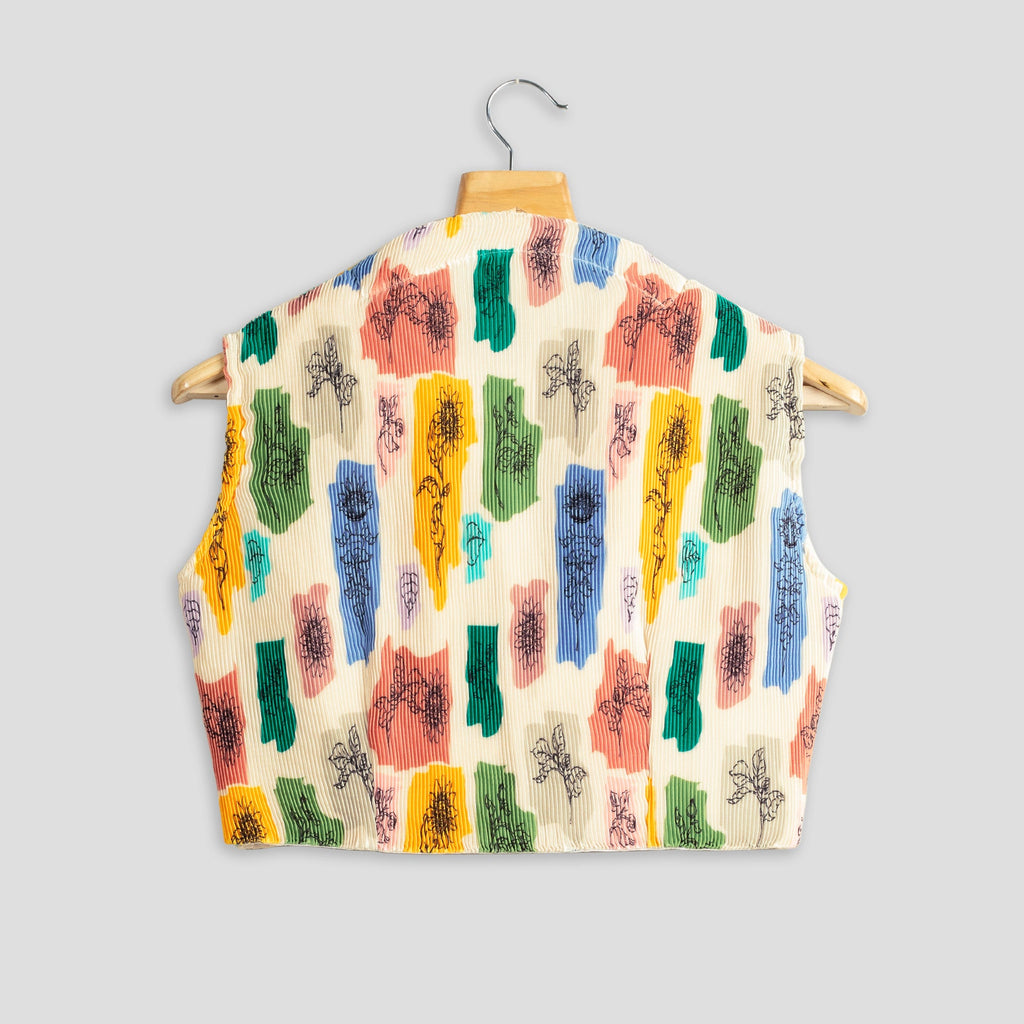 Blusa plisada beige con estampado floral abstracto
